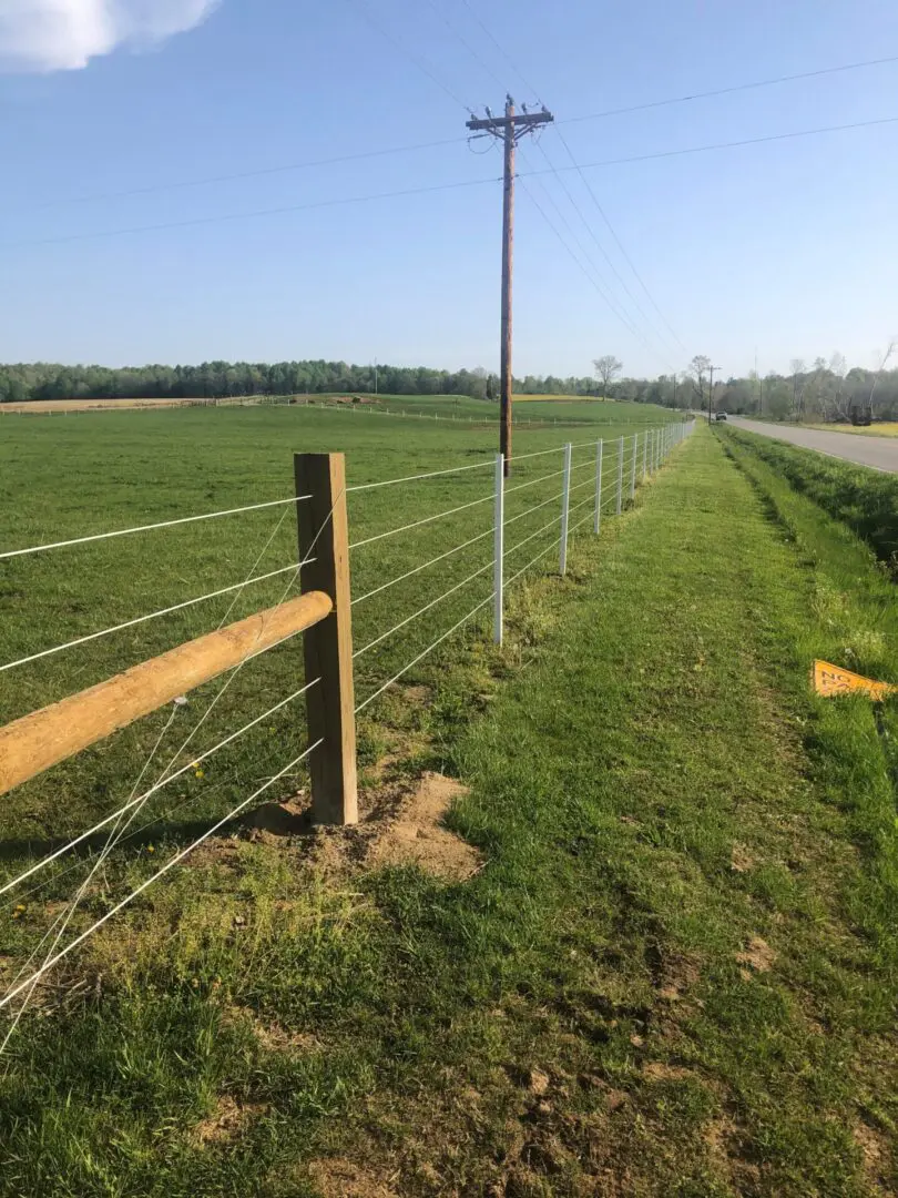 Electric Pole with Wires Inside Fence