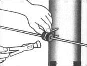 Here's an alt tag for the image: Attaching wire to post with clamp.