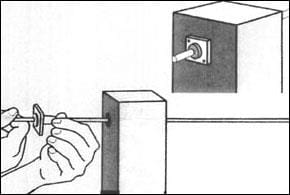 Here's an alt tag for the image: `Installing a fence post bracket.`